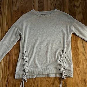 Cute gray sweater with ribbon accents in size medium. Willing to change price